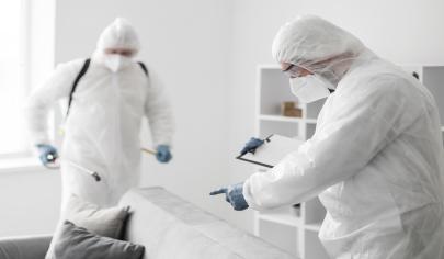 Bed bug removal service being performed in a fully furnished apartment